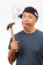 9099752-middle-age-man-with-hammer.jpg